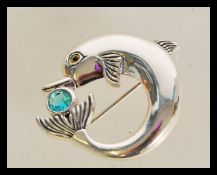 A 20th century sterling silver brooch in the form