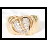 A contemporary hallmarked 18ct gold ring having a