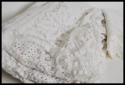 A vintage early 20th century square white linen ta