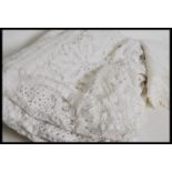 A vintage early 20th century square white linen ta