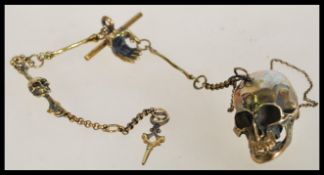 A vintage 20th century brass Albert watch chain wi