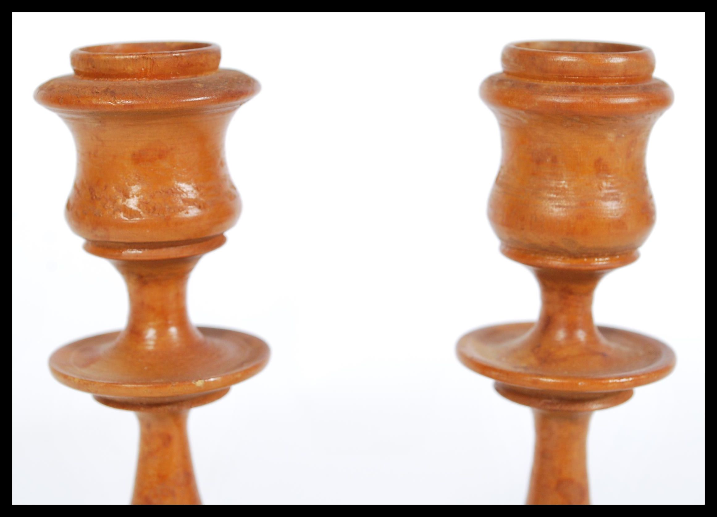 A 19th century pair of treen wooden candlesticks h - Image 2 of 4