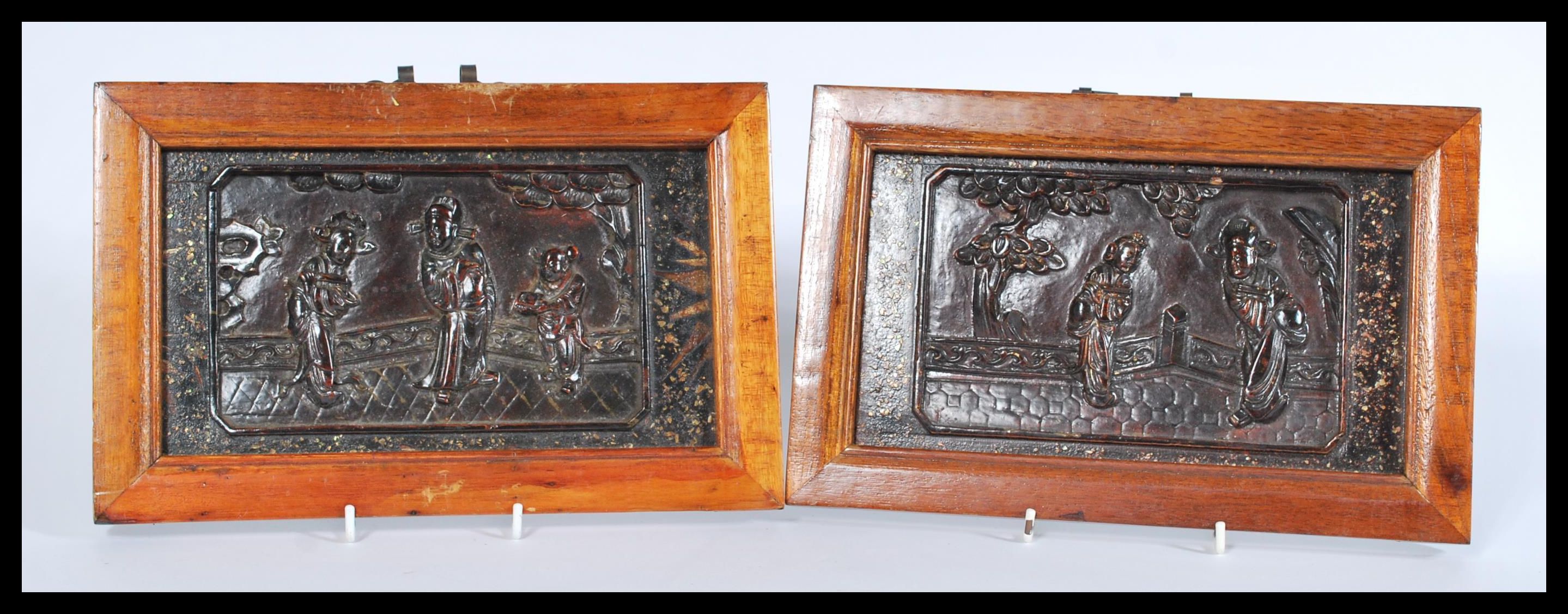 A pair of 19th century Chinese lacquer panels feat