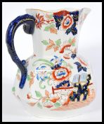 A 19th century large Masons jug having a chinoiser