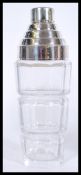 A vintage Art Deco style cocktail shaker with cut