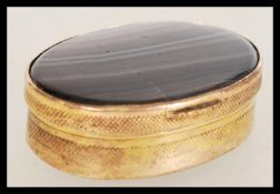 An Agate box of oval form with two pieces of stone