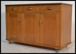 A 20th century blond sideboard by Priory furniture