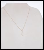 An 19ct rose gold and diamond pendant necklace hav