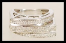 A hallmarked 9ct white gold ring with pave set dia