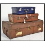 A good stack group of four vintage luggage to incl