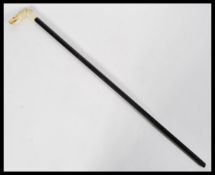 A 19th century handled cane with ebony shaft and c