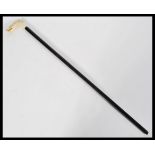 A 19th century handled cane with ebony shaft and c