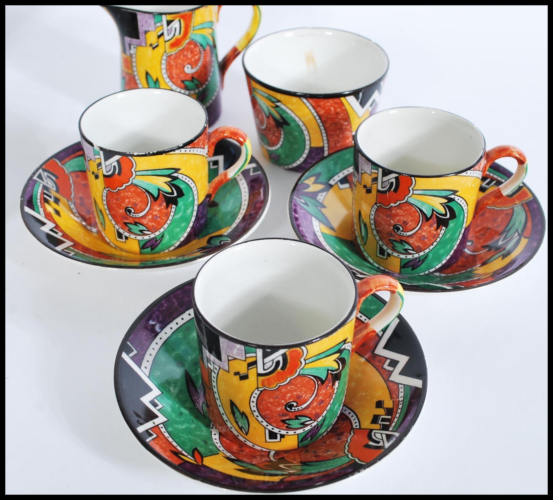 A retro vintage chine tea service with a coloured geometric shape pattern, to include six cups and - Image 4 of 6