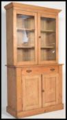 A 19th Century Victorian pine farmhouse kitchen dresser, glazed upper section surmounted with