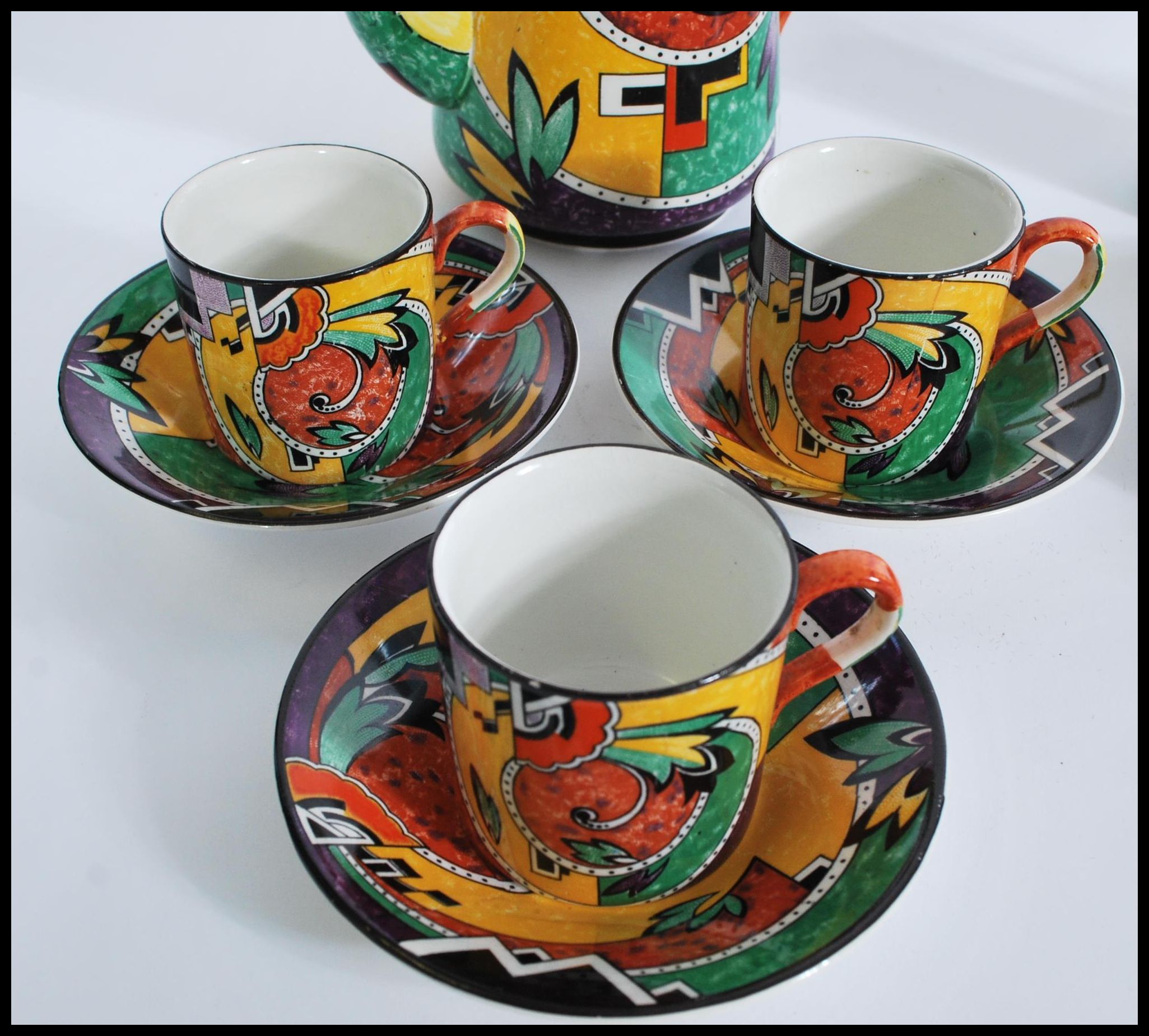 A retro vintage chine tea service with a coloured geometric shape pattern, to include six cups and - Image 2 of 6