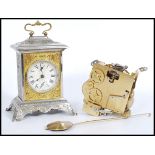 A vintage 20th Century pressed bracket clock, the case pressed with classical scenes together with a