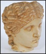 A 20th century composite classical Grecian bust head jardiniere having moulded and detailed