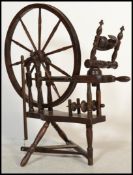 A believed  early 20th century North County Spinning Wheel having turned legs bobbin style base with