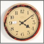 A vintage retro 20th century Synchrome industrial electric wall clock of circular form with