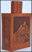 A 19th century carved Chinese wooden tea caddy of hexagonal form having hand carved scenes of an