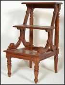 A 20th century Regency Revival set of mahogany library steps raised on turned legs with reeded