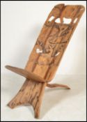 An early 20th century African Kenyan hardwood birthing chair comprised of two parts with carved