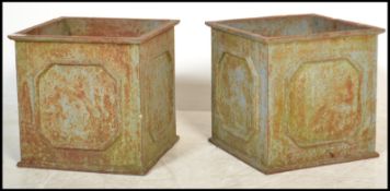 A pair of vintage early 20th Century weather worn Regency revival style  cast iron planters of