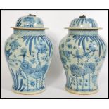 A pair Chinese blue and white large tall lidded vases having hand painted decorated with