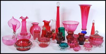 A collection of Victorian 19th century and 20th century cranberry glass to include a good tall