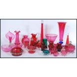 A collection of Victorian 19th century and 20th century cranberry glass to include a good tall