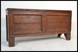 An 18th century George III country oak mule chest