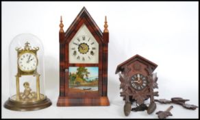 A collection of three vintage clocks to include an anniversary clock, American Gingerbread clock