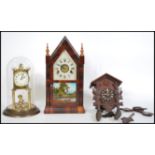 A collection of three vintage clocks to include an anniversary clock, American Gingerbread clock