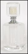 A vintage 20th century Art Deco faceted cut glass perfume bottle, the stopper having a pearl bead