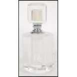 A vintage 20th century Art Deco faceted cut glass perfume bottle, the stopper having a pearl bead