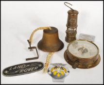 A collection of vintage 20th Century items, to include a barometer, hand held bell, AA car badge,