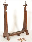 A late 19th century / ear;y 20th century mahogany tapestry stand raised on four block legs.