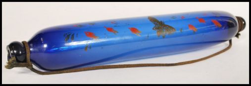 A 19th Century possibly Thomas Webb Bristol blue glass rolling pin, decorated with painted flowers