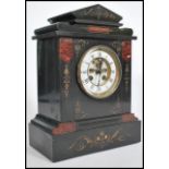 A 19th century Victorian slate and rouge marble mantel clock with enamelled roman numeral chapter