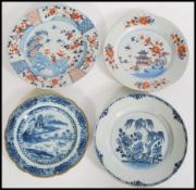 A group of four 18th century Chinese porcelain plates to include two blue and white examples and two