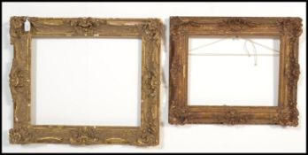 Two early 20th century wooden gesso moulded gilt picture frames, having scrolled acanthus leaf