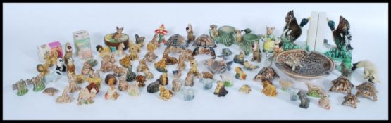 A large collection of vintage / retro 20th Century Wade whimsies, to include animals, ashtrays,
