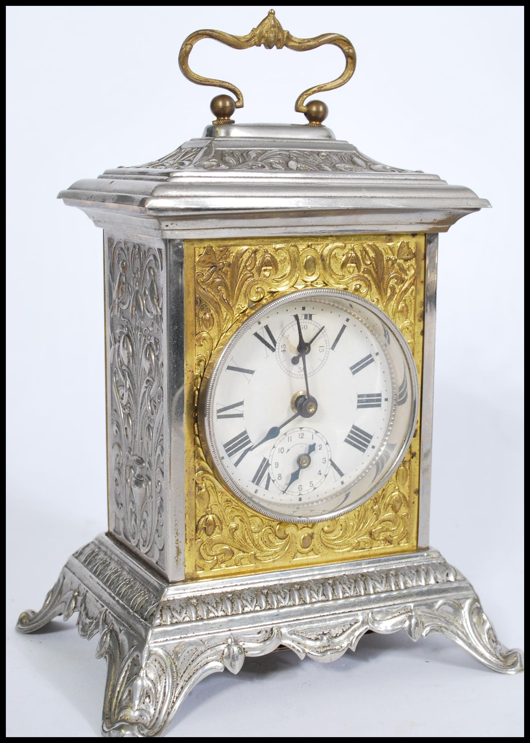 A vintage 20th Century pressed bracket clock, the case pressed with classical scenes together with a - Image 2 of 6