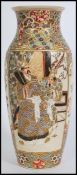 A 19th century Japanese Kutani vase being hand painted with scenes of scholars / warriors in