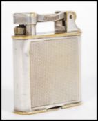 A vintage 20th century Dunhill lighter model No. 390107 having an engine turned design.