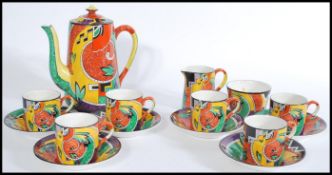 A retro vintage chine tea service with a coloured geometric shape pattern, to include six cups and