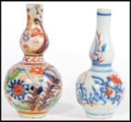 Two 19th century miniature Chinese ceramic vases, one having hand painted blue and white floral