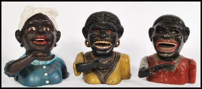 A collection of three cast metal 20th Century money boxes to include Dinah, one with cast mark for