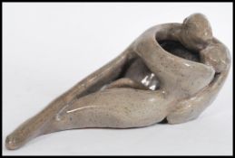 A 20th Century studio pottery sculptural figure group of an entwined couple, marked to base Lovers