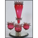 A 19th century Victorian cranberry ruby vaseline glass epergne centrepiece with central trumpet